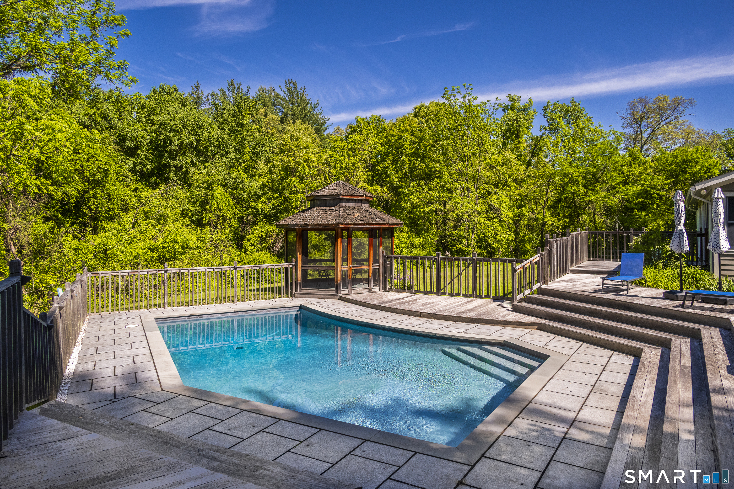 7 Chimney Rock Road Kent, CT 06757 - Photo 29 of 35 a view of a swimming pool with a patio