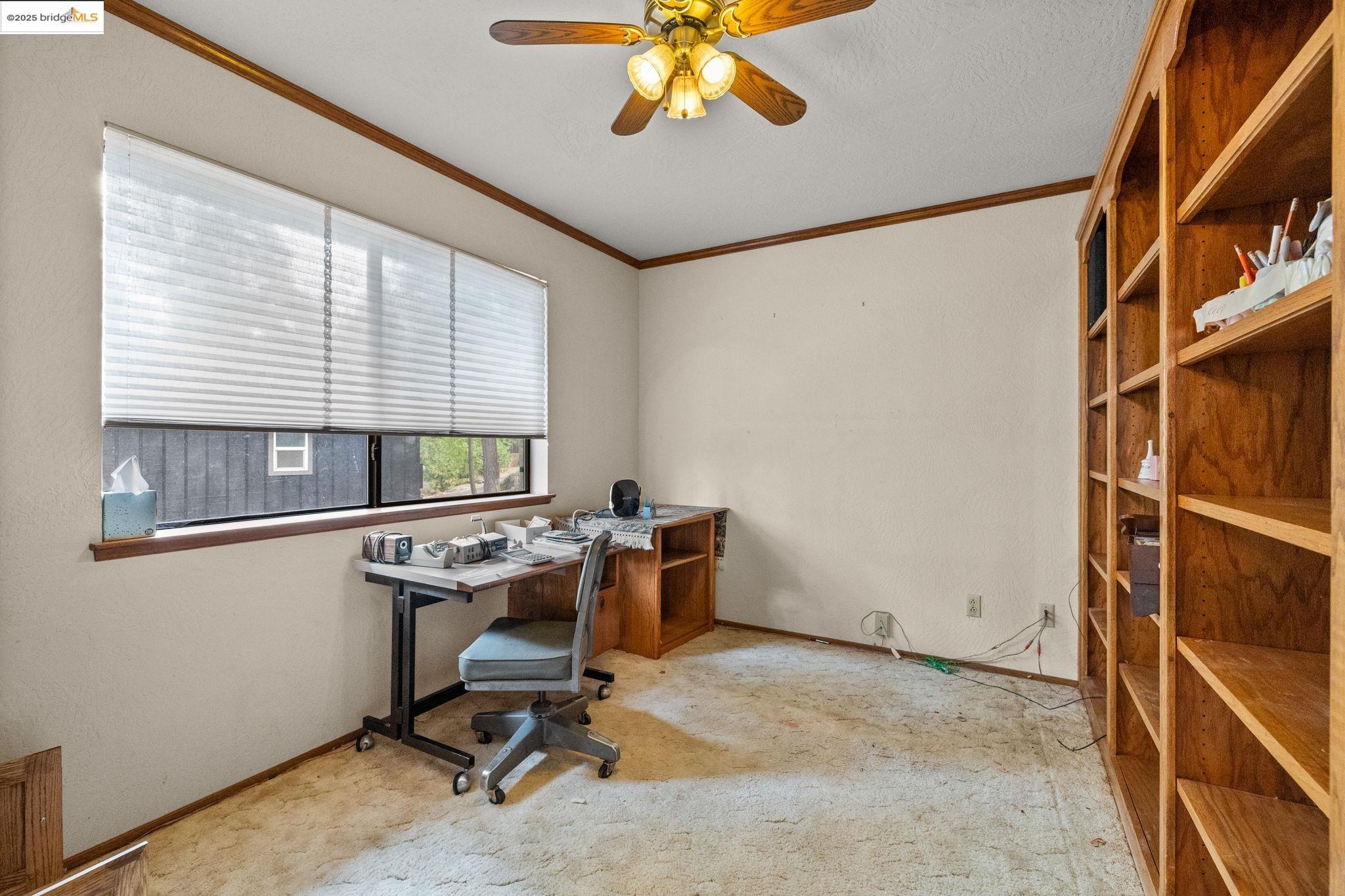 12087 Breckenridge Road Groveland, CA 95321 - Photo 11 of 31 Carpeted home office featuring crown molding and ceiling fan