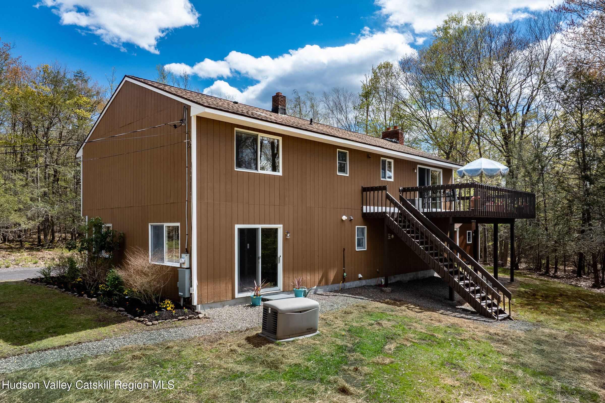 170 Macdaniel Road Woodstock, NY 12498 - Photo 24 of 33 a backyard of a house with barbeque oven and a fountain