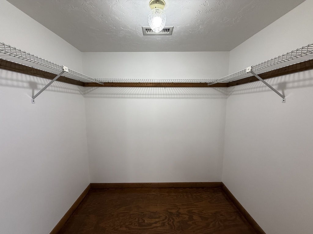 132 Coburn Avenue, Unit 3 Worcester, MA 01604 - Photo 16 of 18 a view of a room with racks on the wall