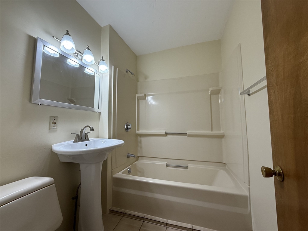 132 Coburn Avenue, Unit 3 Worcester, MA 01604 - Photo 17 of 18 a bathroom with a sink a toilet and shower