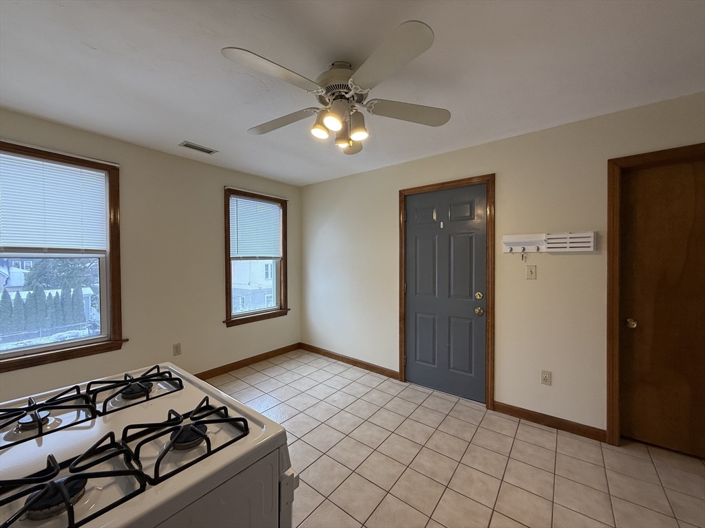132 Coburn Avenue, Unit 3 Worcester, MA 01604 - Photo 7 of 18 a view of a livingroom with furniture and chandelier fan
