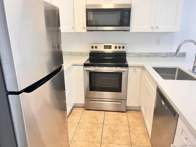 a kitchen with a stove and a microwave