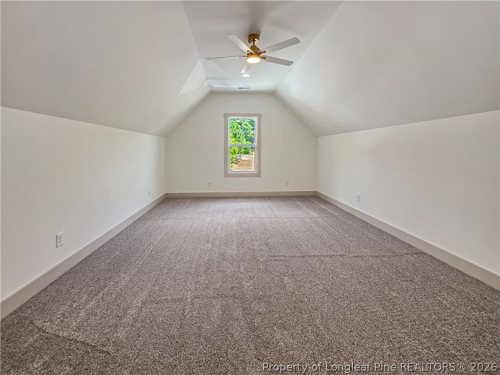 900 Niagara Carthage Road Carthage, NC 28327 - Photo 23 of 38 an empty room with windows and ceiling fan