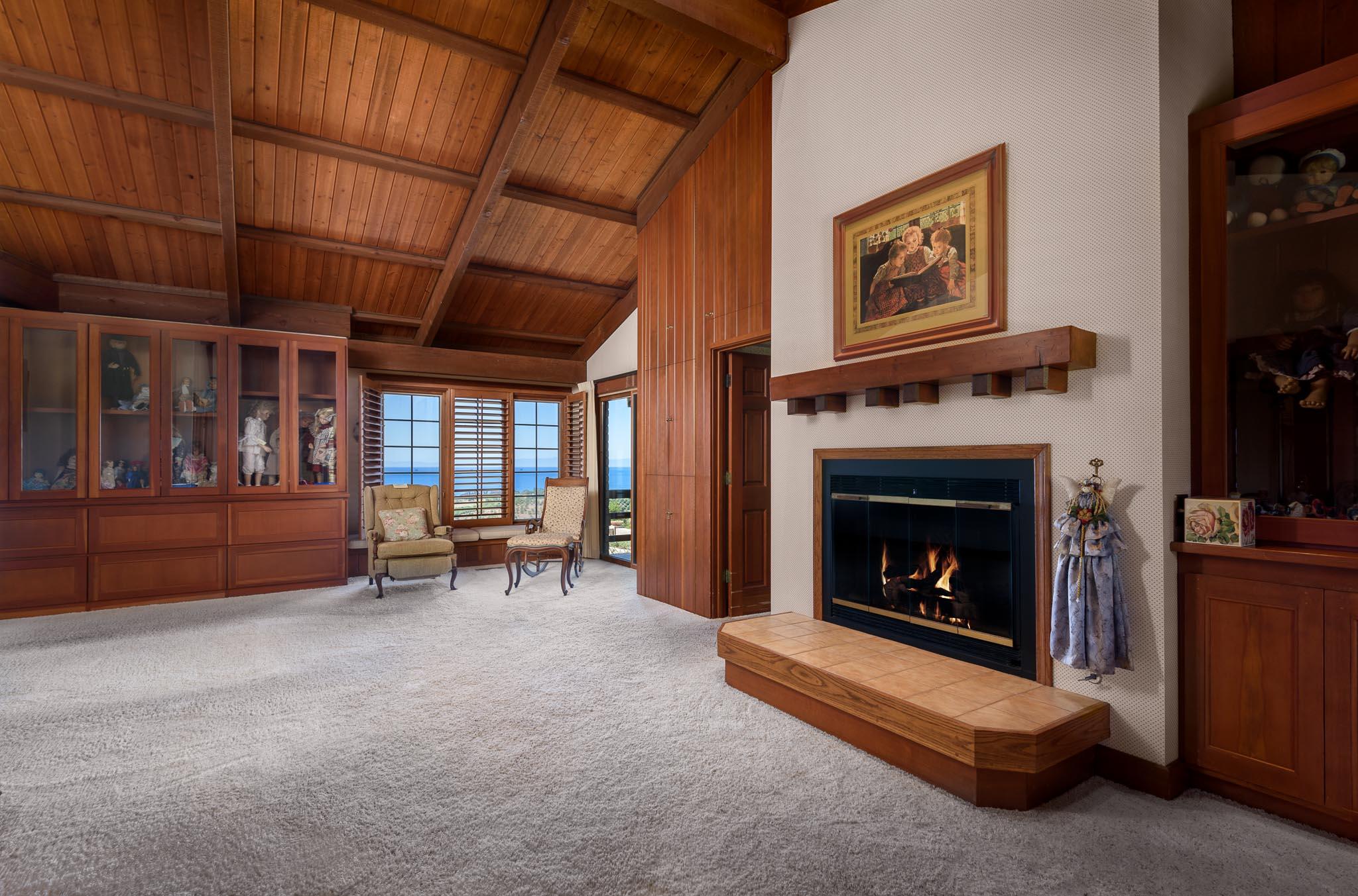 450 Lambert Road Carpinteria, CA 93013 - Photo 13 of 21 a living room with furniture and a fireplace