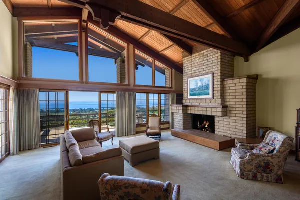 a living room with furniture or fireplace and a chandelier