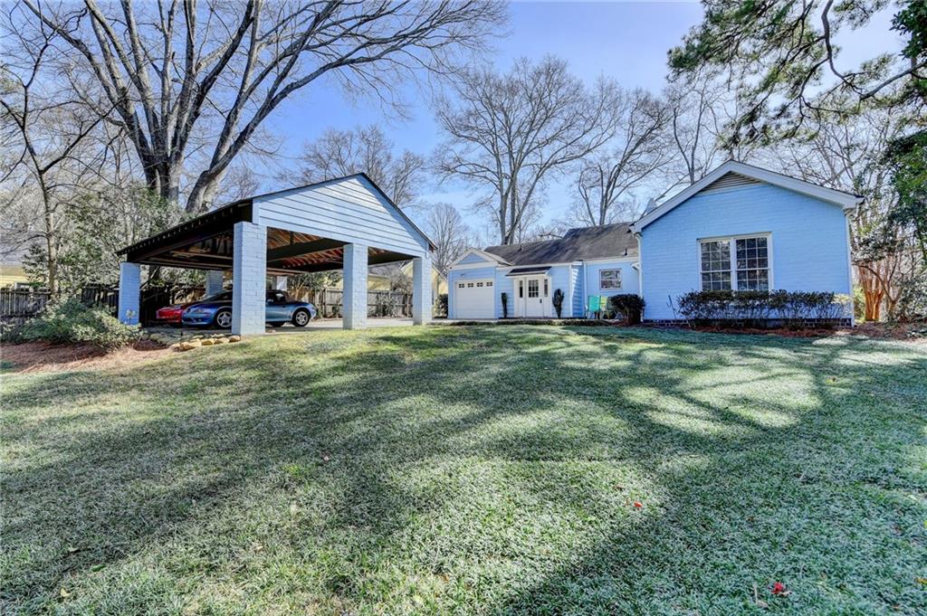 1926 North Decatur Road Atlanta, GA 30307 - Photo 39 of 40 a view of a house with a big yard and large tree