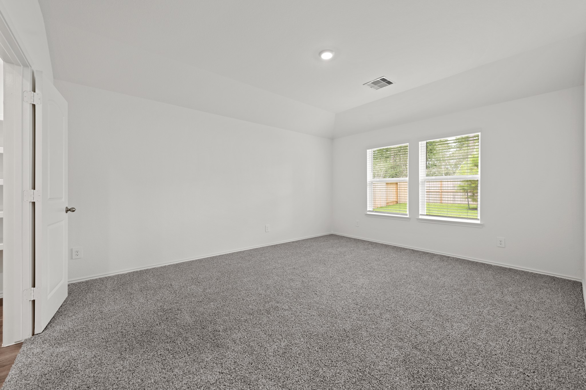 14270 Moon Flower Drive Splendora, TX 77372 - Photo 4 of 13 an empty room with windows