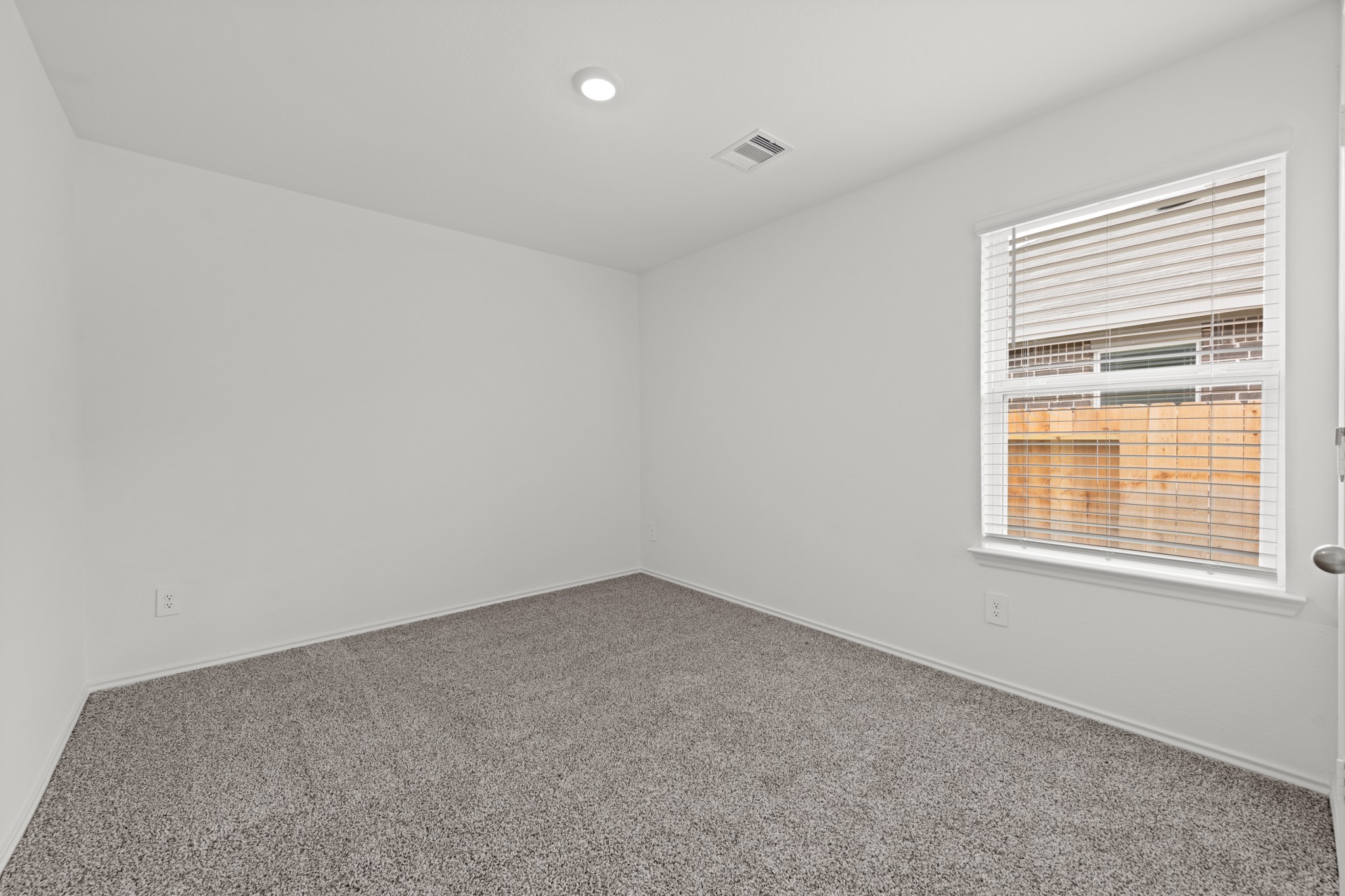 14270 Moon Flower Drive Splendora, TX 77372 - Photo 5 of 13 an empty room with a window