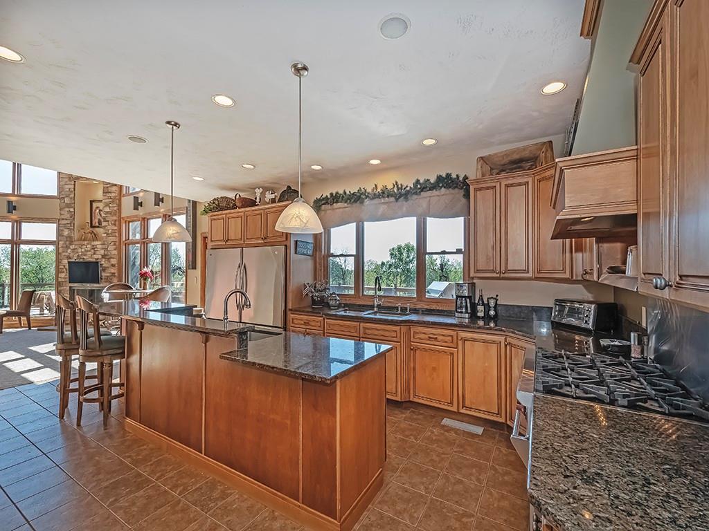 166 McKay Road Saxonburg, PA 16056 - Photo 13 of 47 a kitchen with lots of counter top space and living room