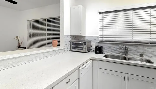 a kitchen with a sink and a window