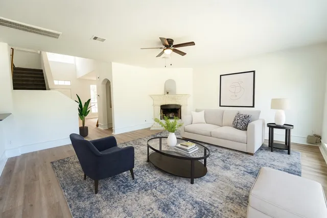 a living room with furniture fireplace and a flat screen tv