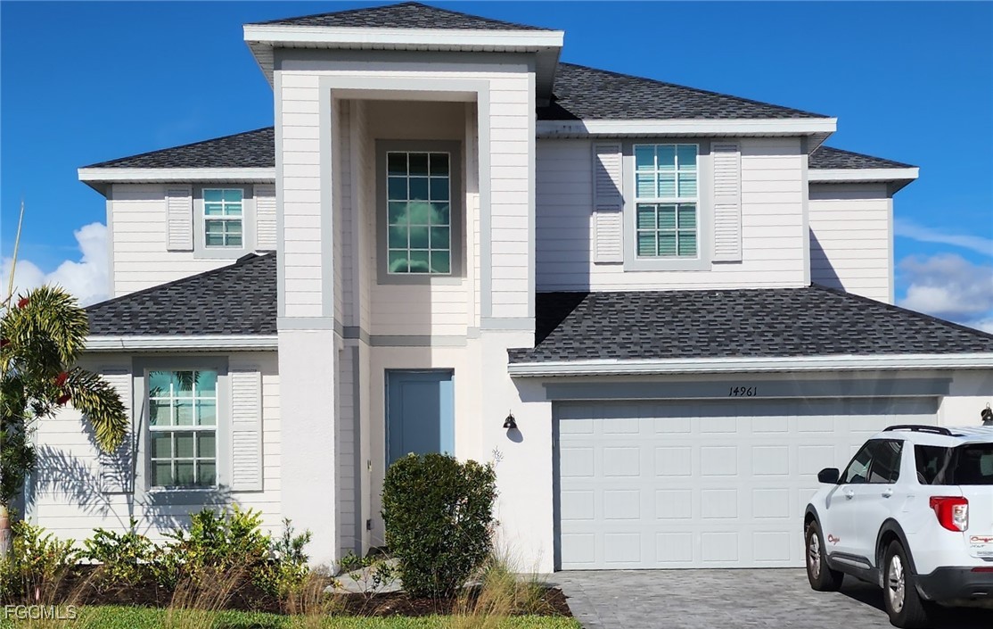 14961 Anchorage Road Punta Gorda, FL 33982 - Photo 1 of 2 a car parked in front of white house