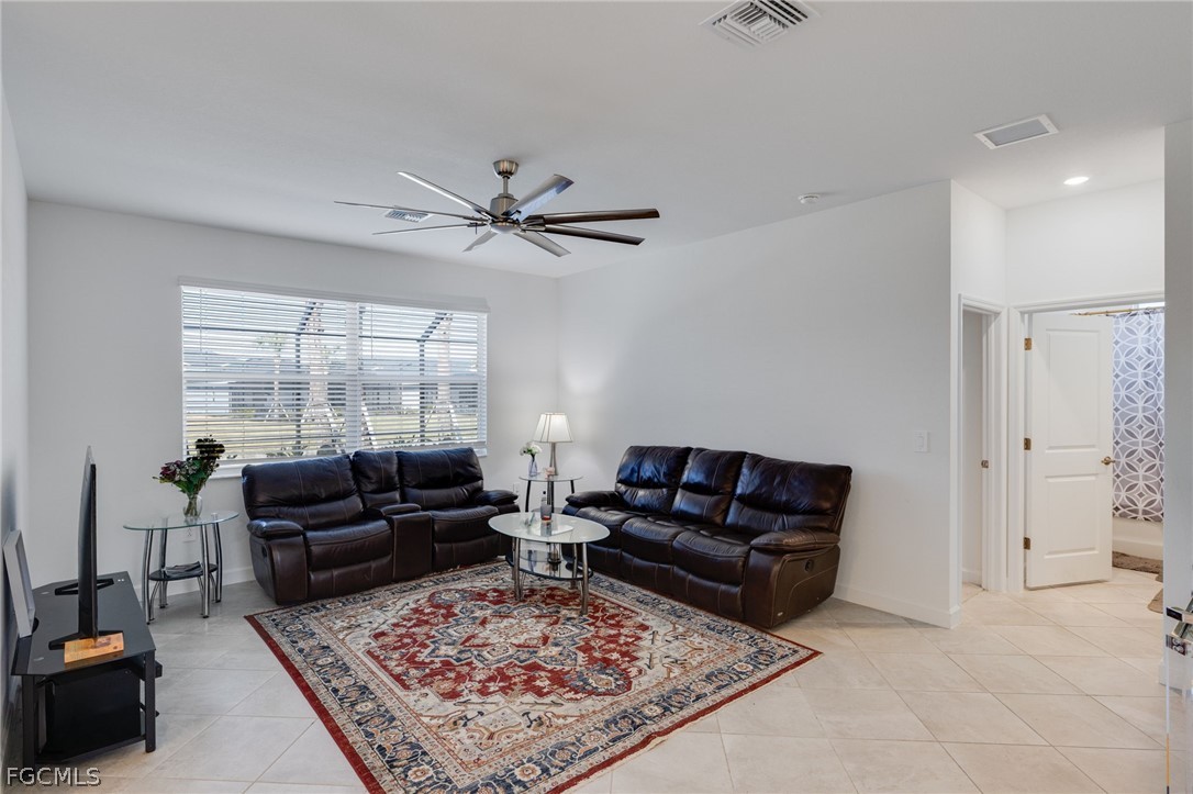 14961 Anchorage Road Punta Gorda, FL 33982 - Photo 15 of 32 a living room with furniture a rug and a large window