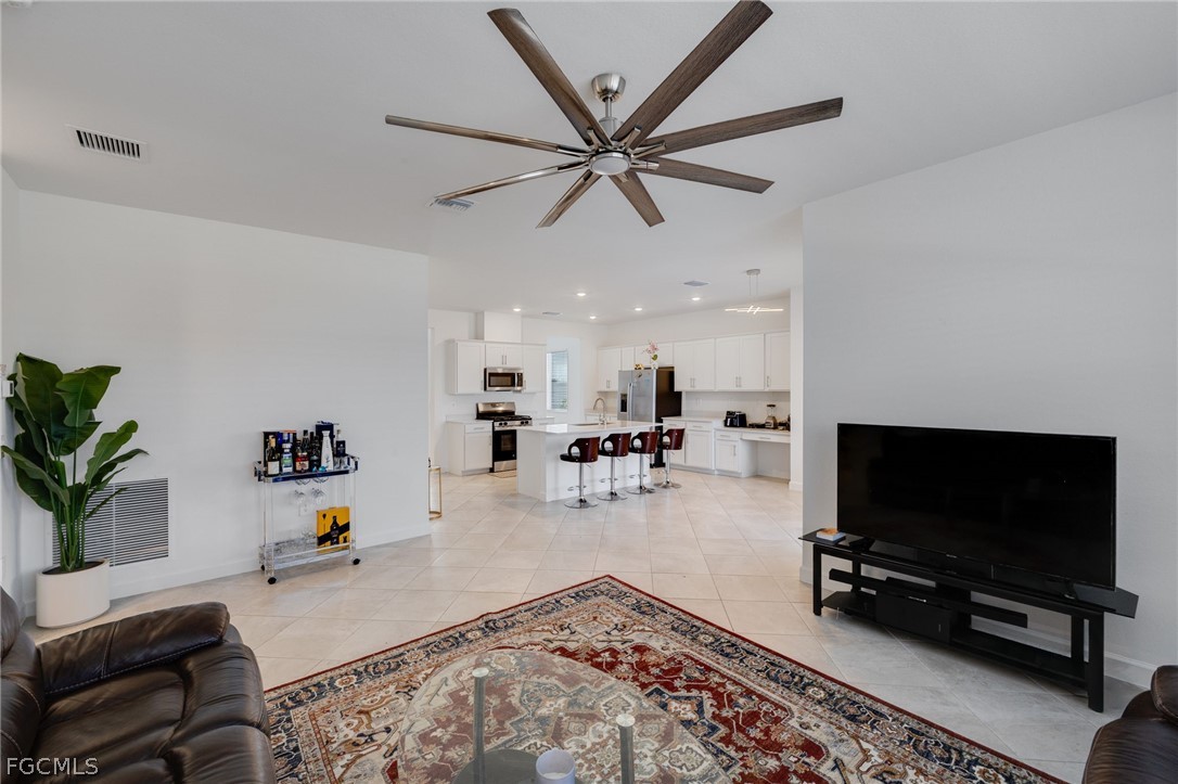 14961 Anchorage Road Punta Gorda, FL 33982 - Photo 16 of 32 a living room with furniture and a flat screen tv