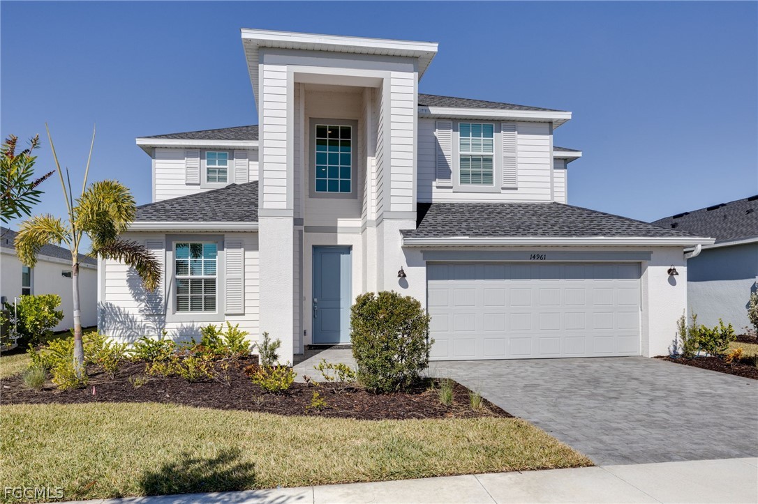 14961 Anchorage Road Punta Gorda, FL 33982 - Photo 2 of 32 a front view of a house with garden