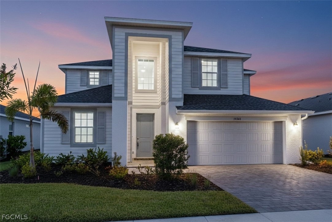 14961 Anchorage Road Punta Gorda, FL 33982 - Photo 3 of 32 a front view of a house with garden