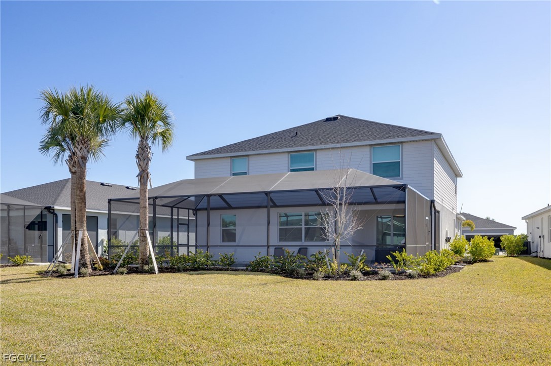 14961 Anchorage Road Punta Gorda, FL 33982 - Photo 31 of 32 a front view of a house with yard and garage