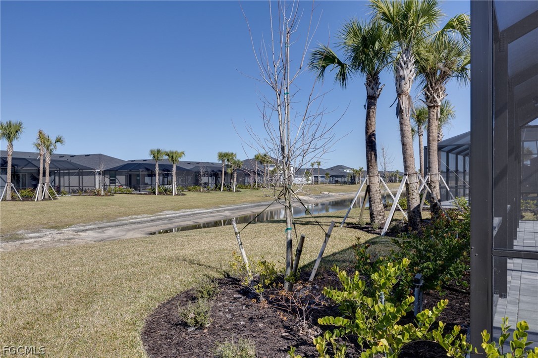 14961 Anchorage Road Punta Gorda, FL 33982 - Photo 32 of 32 a view of swimming pool with outdoor seating and plants