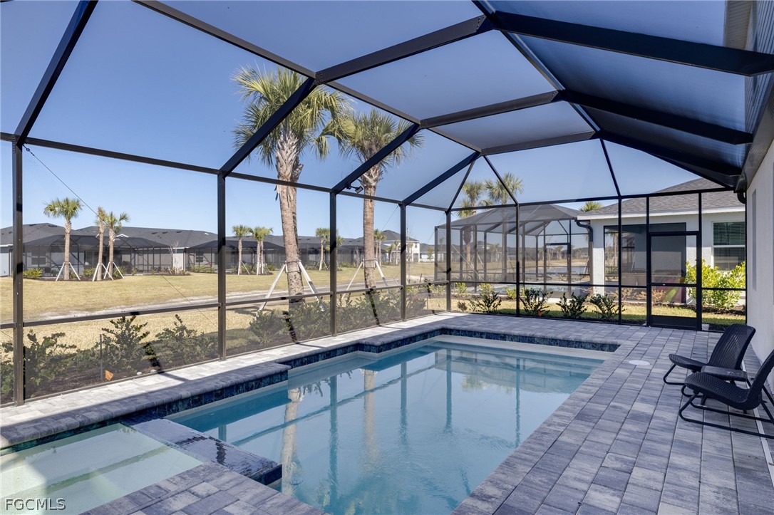 14961 Anchorage Road Punta Gorda, FL 33982 - Photo 5 of 32 a swimming pool with outdoor seating and yard