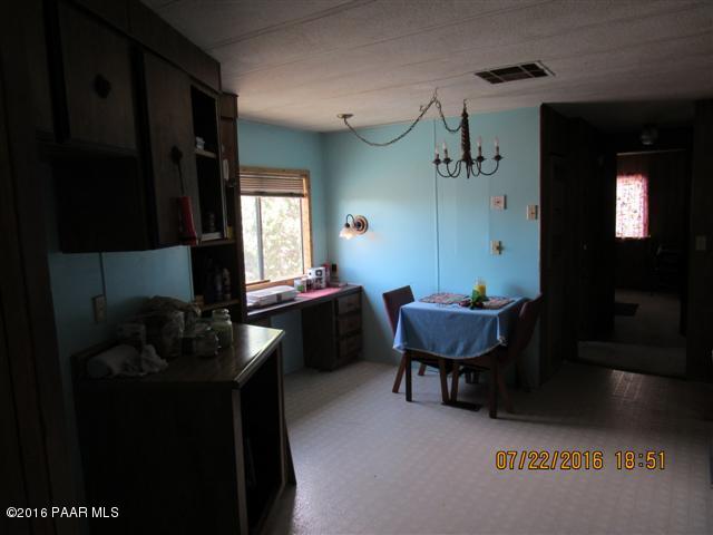 3375 Double A Ranch Road Williams, AZ 86046 - Photo 5 of 11 a living room with furniture a window and a sink