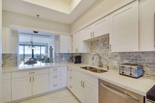 a kitchen with a sink and cabinets