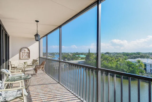 a view of a balcony with furniture