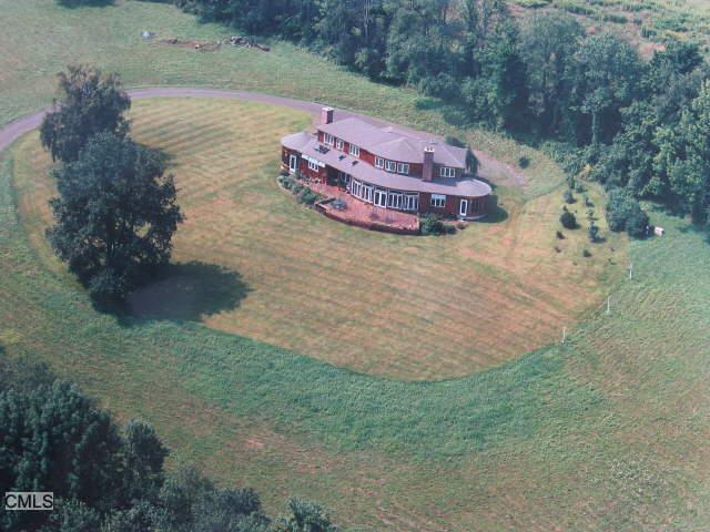 a view of a tiny house with a yard