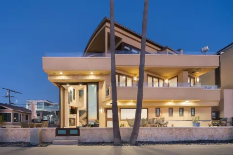 a view of a balcony with couch and chairs