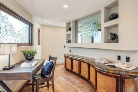 a kitchen with a table and chairs in it