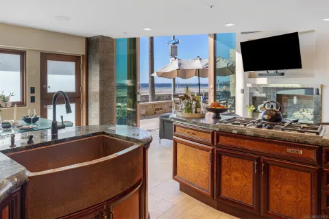 a kitchen with stainless steel appliances granite countertop a sink and a microwave
