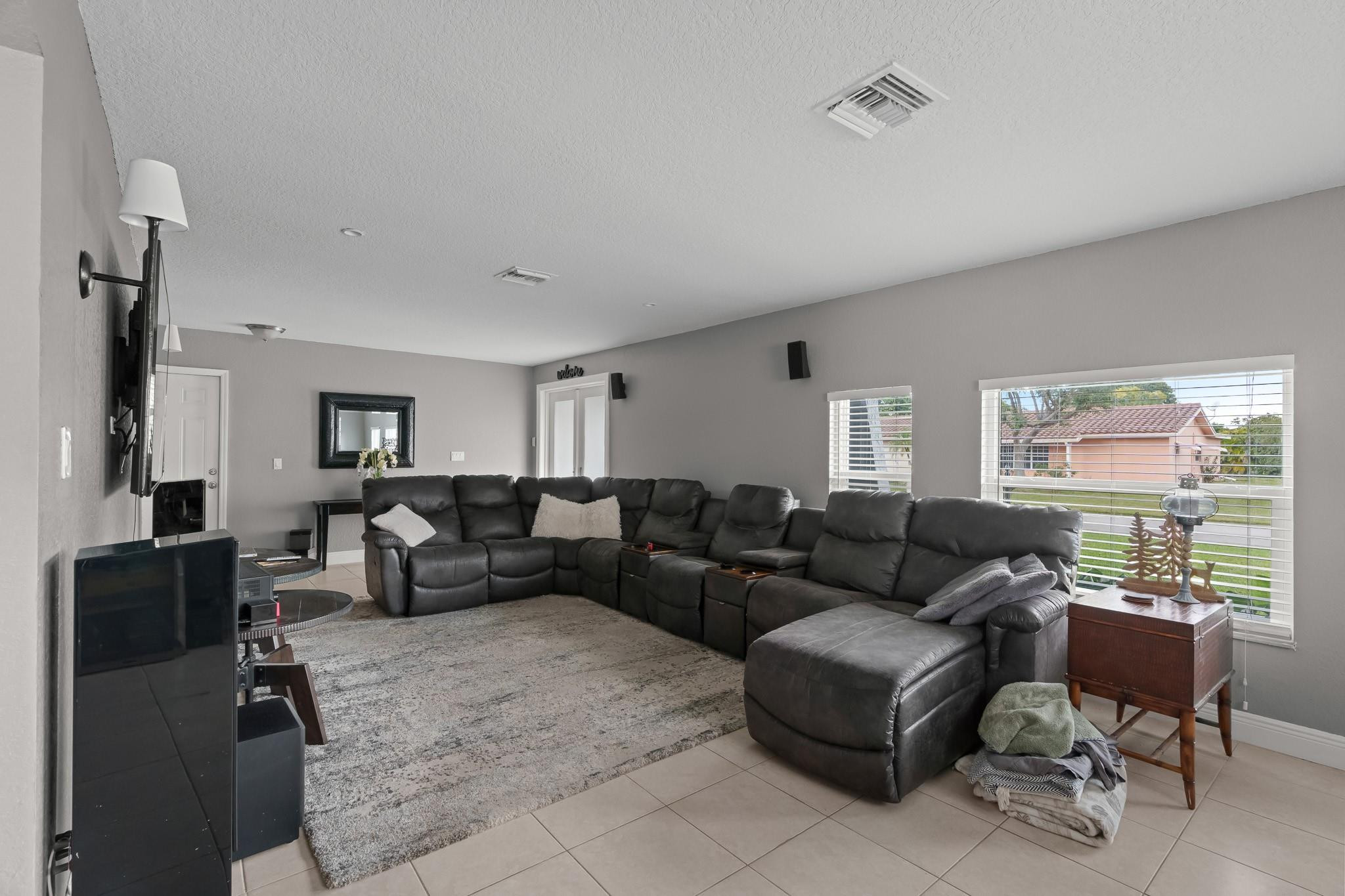 9402 Northwest 70th Street Tamarac, FL 33321 - Photo 11 of 60 a living room with furniture and a window