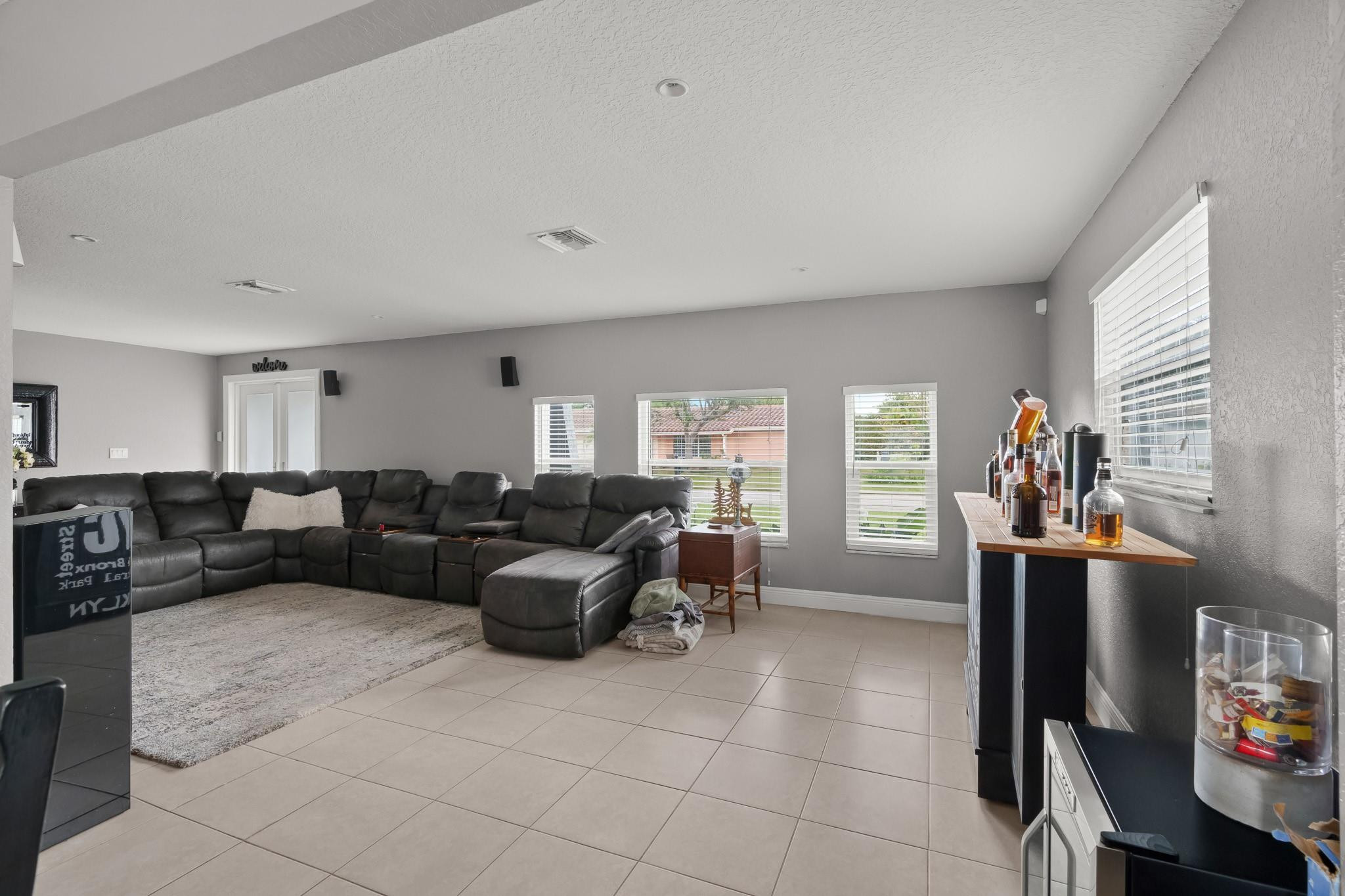9402 Northwest 70th Street Tamarac, FL 33321 - Photo 12 of 60 a living room with furniture and a window