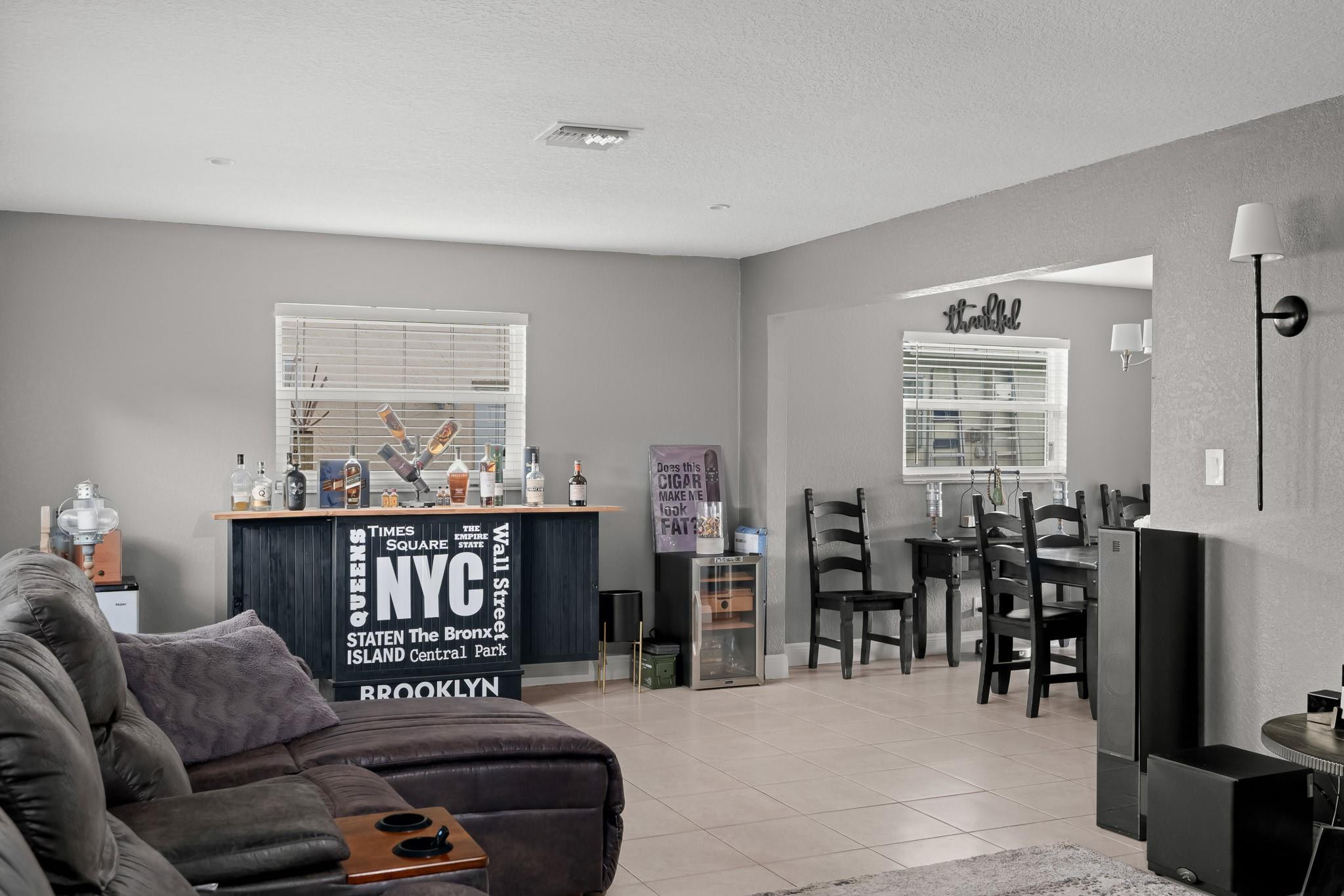9402 Northwest 70th Street Tamarac, FL 33321 - Photo 13 of 60 a living room with furniture and wooden floor