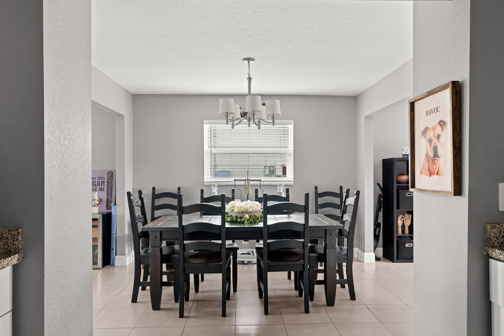 9402 Northwest 70th Street Tamarac, FL 33321 - Photo 16 of 60 a view of a dining room with furniture and window