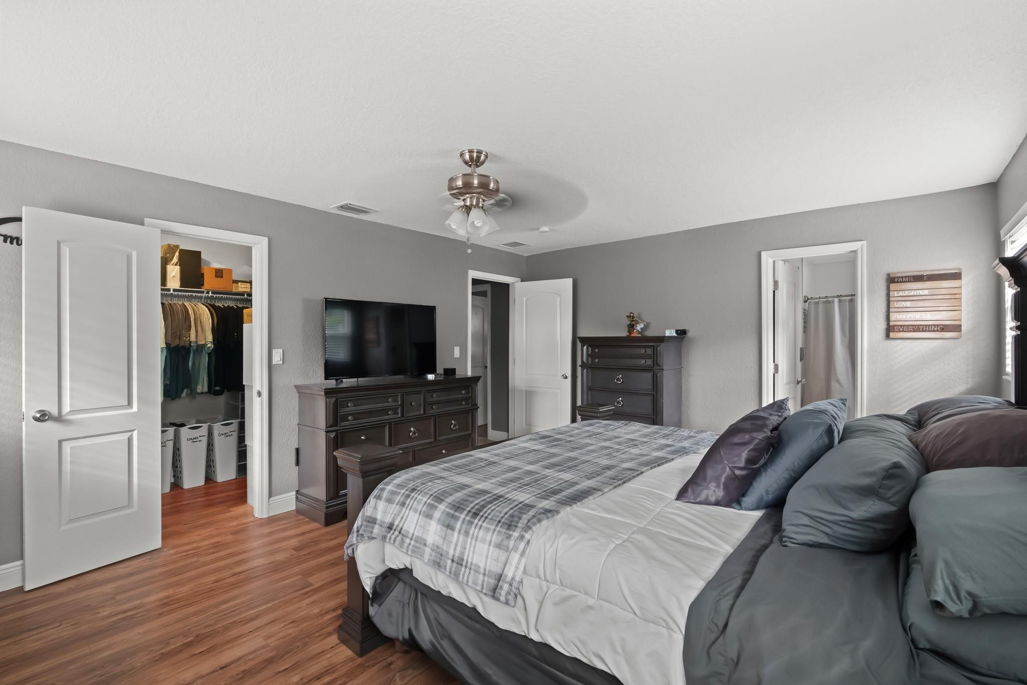 9402 Northwest 70th Street Tamarac, FL 33321 - Photo 34 of 60 a spacious bedroom with a bed and a flat screen tv