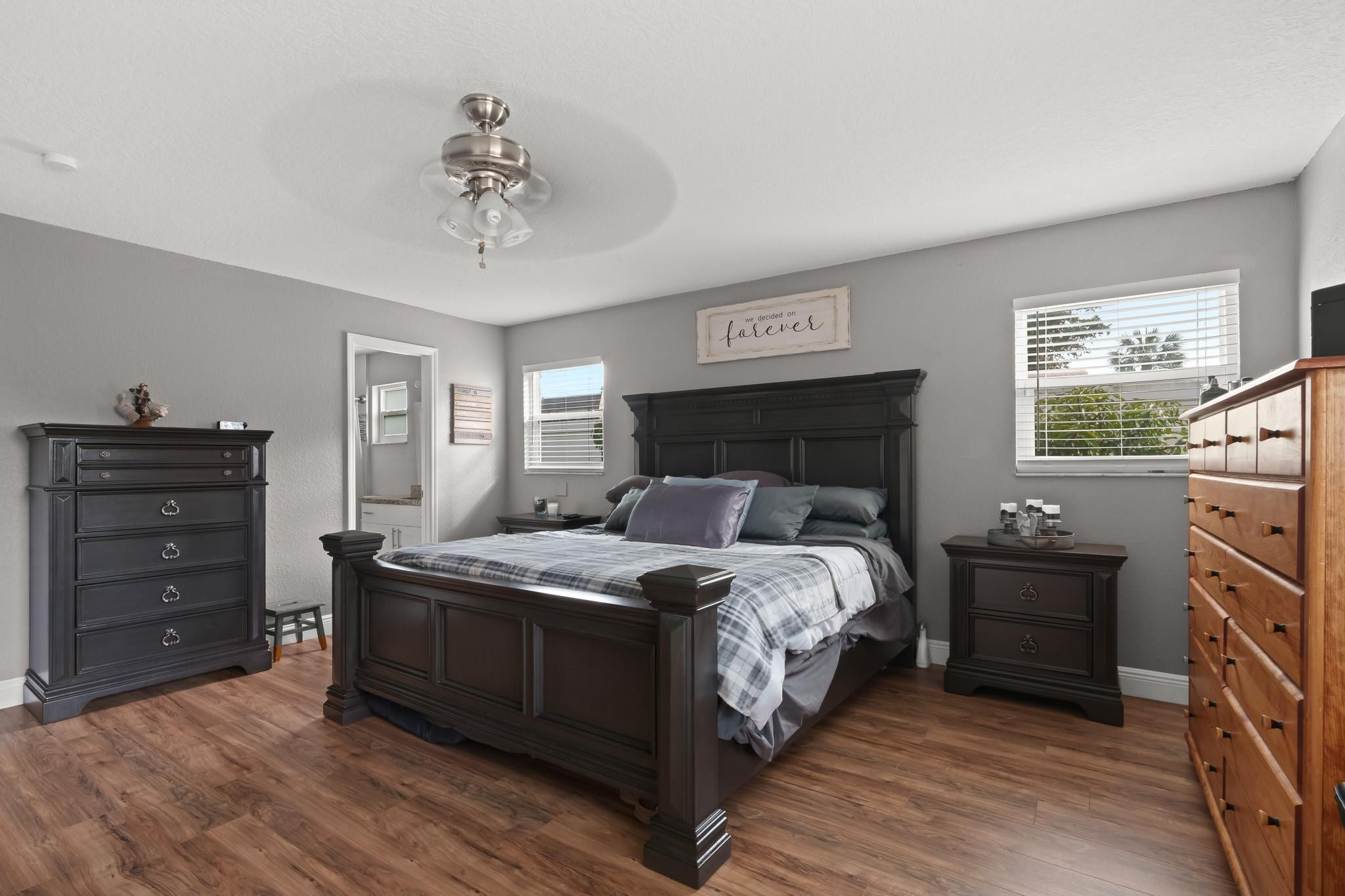 9402 Northwest 70th Street Tamarac, FL 33321 - Photo 35 of 60 a bedroom with a bed and a dresser