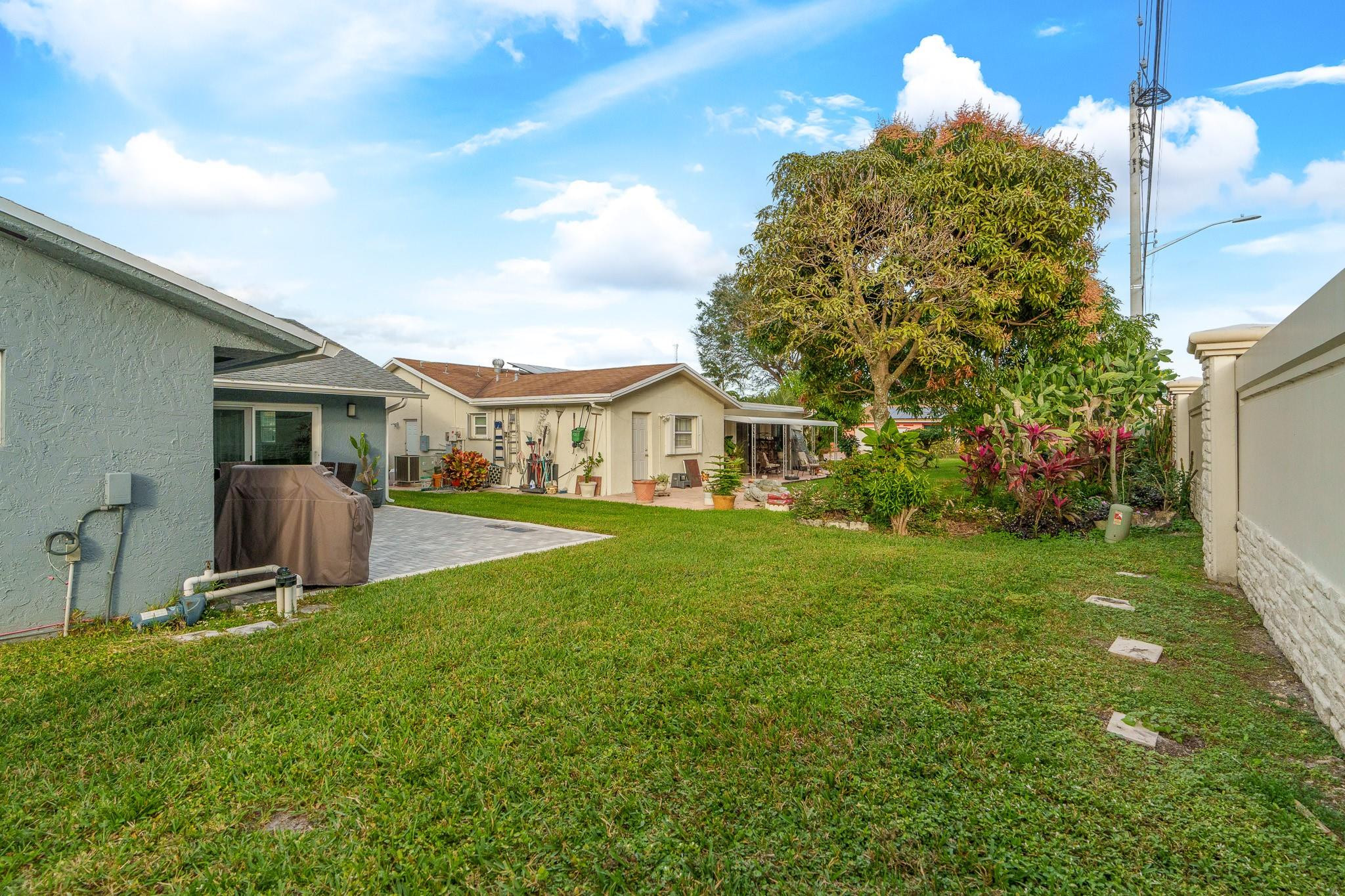 9402 Northwest 70th Street Tamarac, FL 33321 - Photo 52 of 60 a view of house with garden