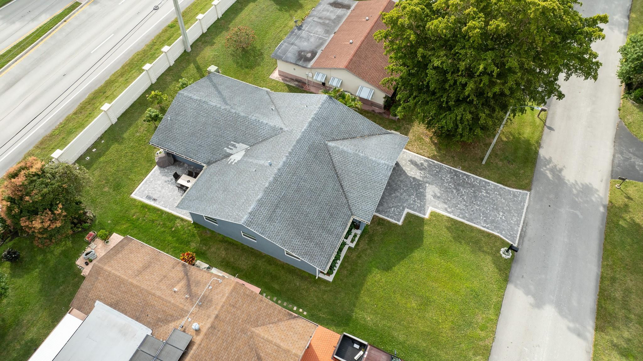 9402 Northwest 70th Street Tamarac, FL 33321 - Photo 53 of 60 an aerial view of a house with a garden and swimming pool