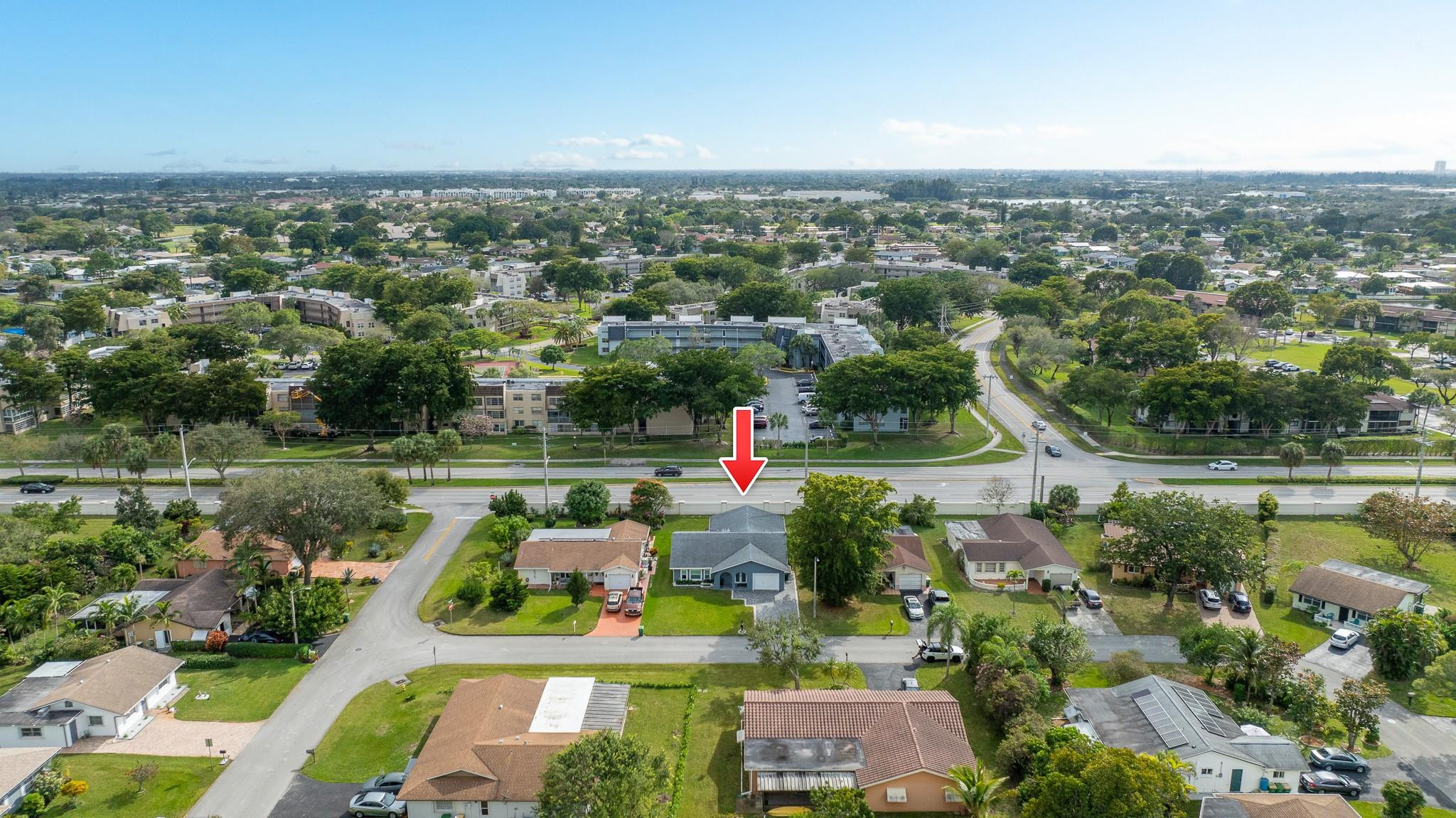 9402 Northwest 70th Street Tamarac, FL 33321 - Photo 55 of 60 an aerial view of a houses with a yard