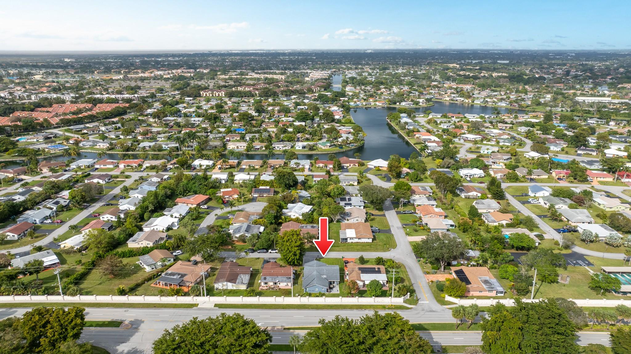 9402 Northwest 70th Street Tamarac, FL 33321 - Photo 56 of 60 an aerial view of residential building and lake