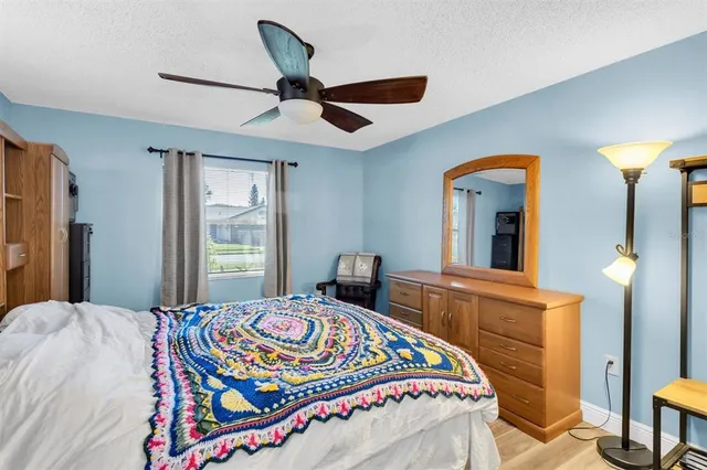 a bedroom with bed and a window