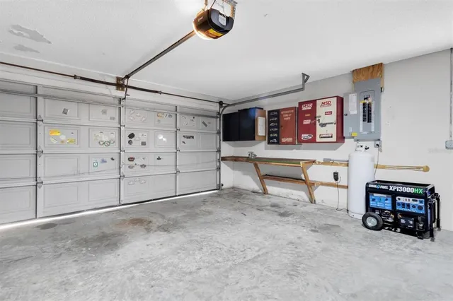 a bed room with a bed and a chair