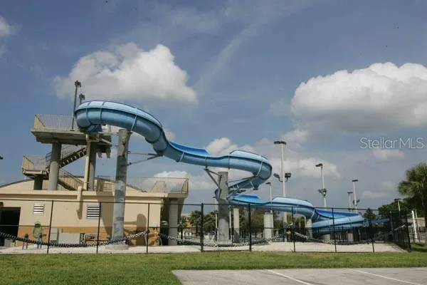 a front view of a building with a garden