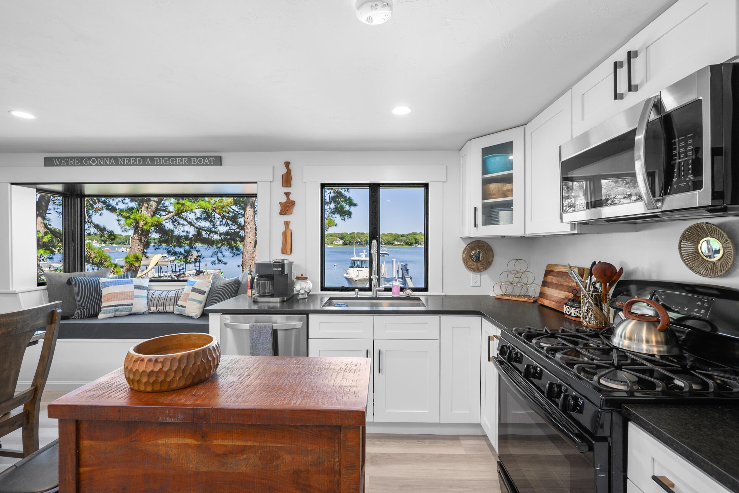 18 Great River Road Mashpee, MA 02649 - Photo 16 of 99 a kitchen with stainless steel appliances granite countertop a stove a sink and a microwave