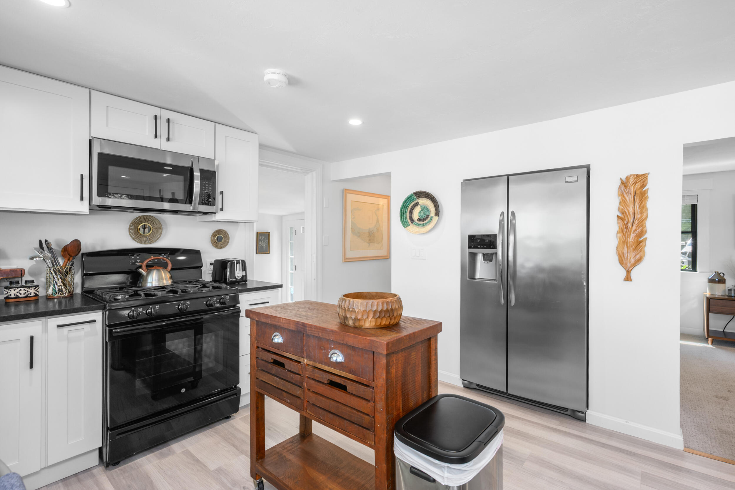 18 Great River Road Mashpee, MA 02649 - Photo 18 of 99 a kitchen with stainless steel appliances granite countertop a stove a sink dishwasher a refrigerator and a microwave