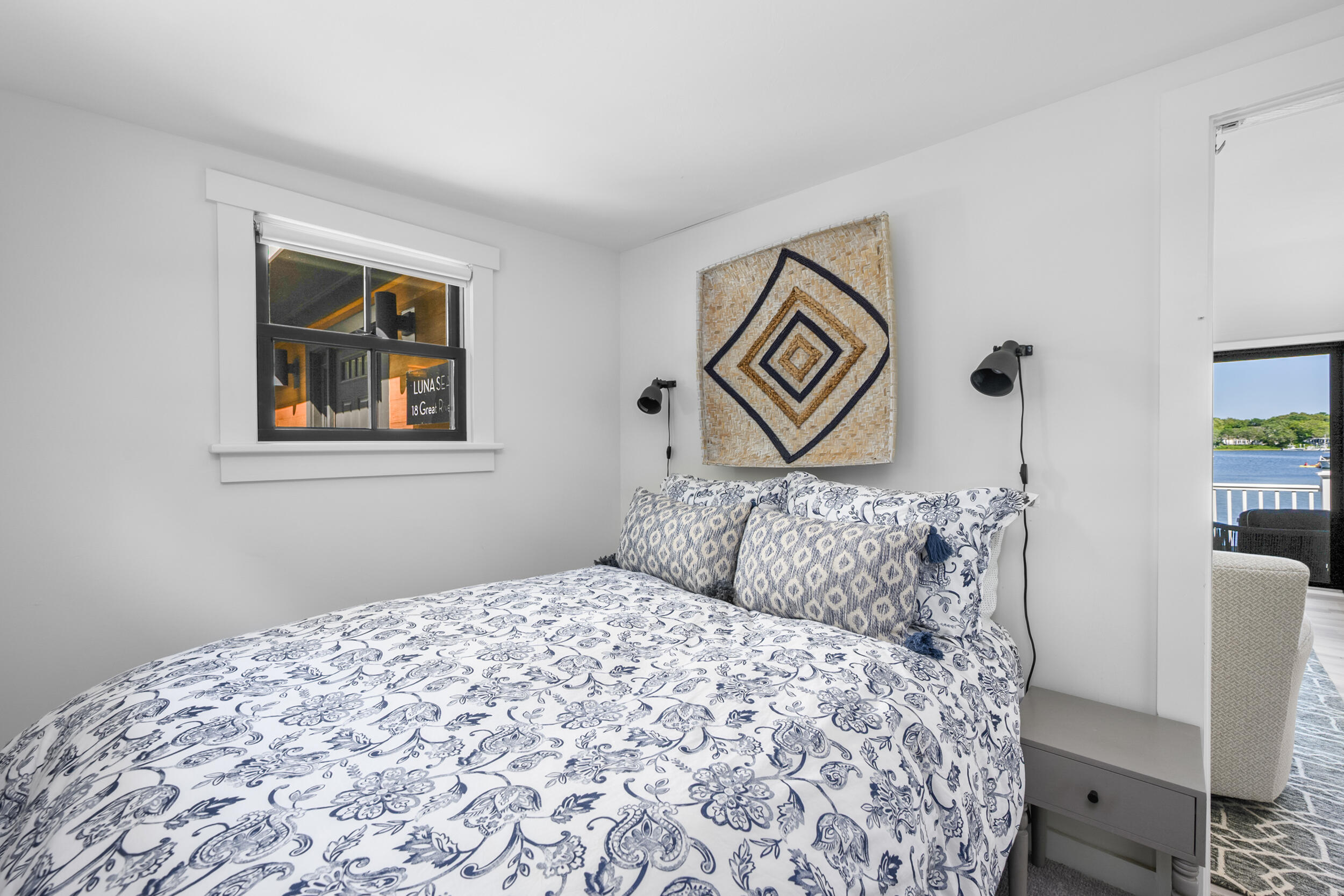 18 Great River Road Mashpee, MA 02649 - Photo 39 of 99 a bedroom with a large bed and a window