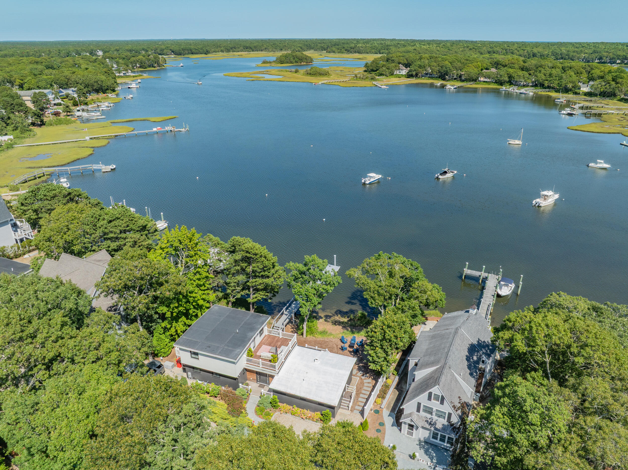 18 Great River Road Mashpee, MA 02649 - Photo 5 of 99 an aerial view of a houses with ocean view