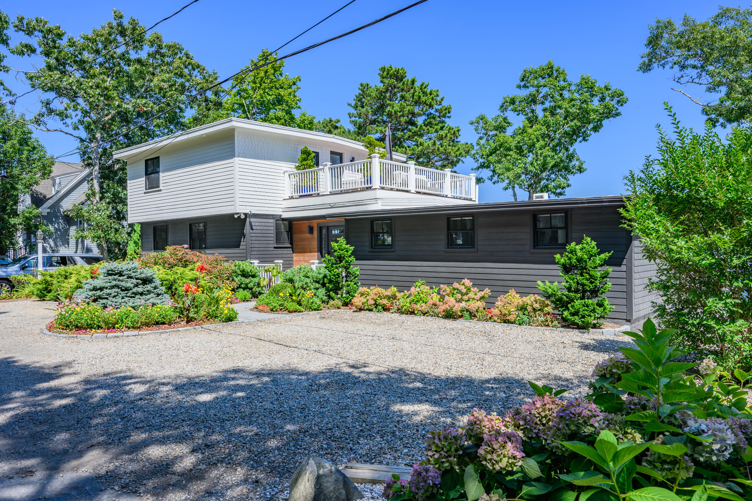 18 Great River Road Mashpee, MA 02649 - Photo 51 of 99 a front view of a house with a yard