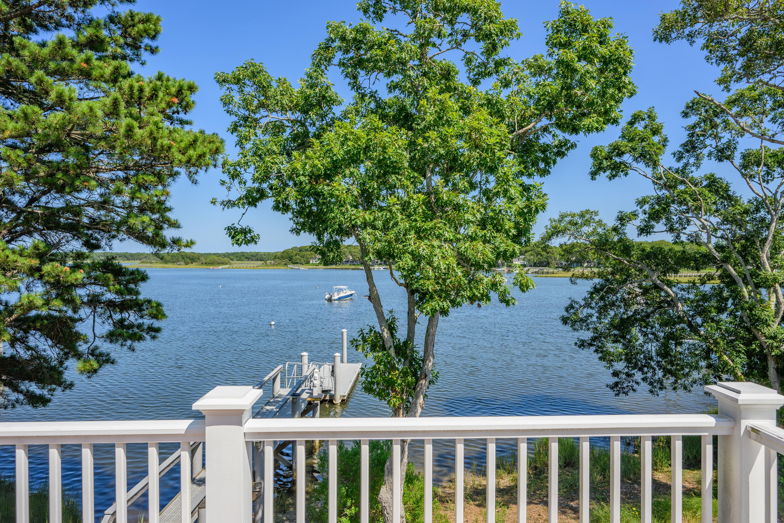 18 Great River Road Mashpee, MA 02649 - Photo 85 of 99 a view of a yard with plants and wooden fence
